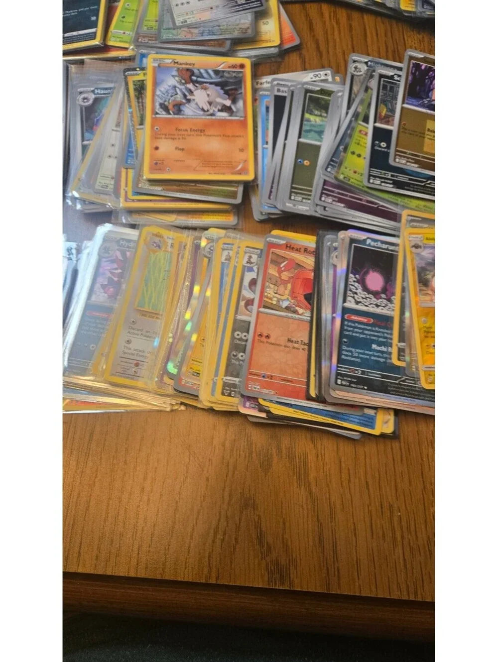 Bulk Lot of Mixed Pokemon Trading Cards with Sleeves and Storage Box